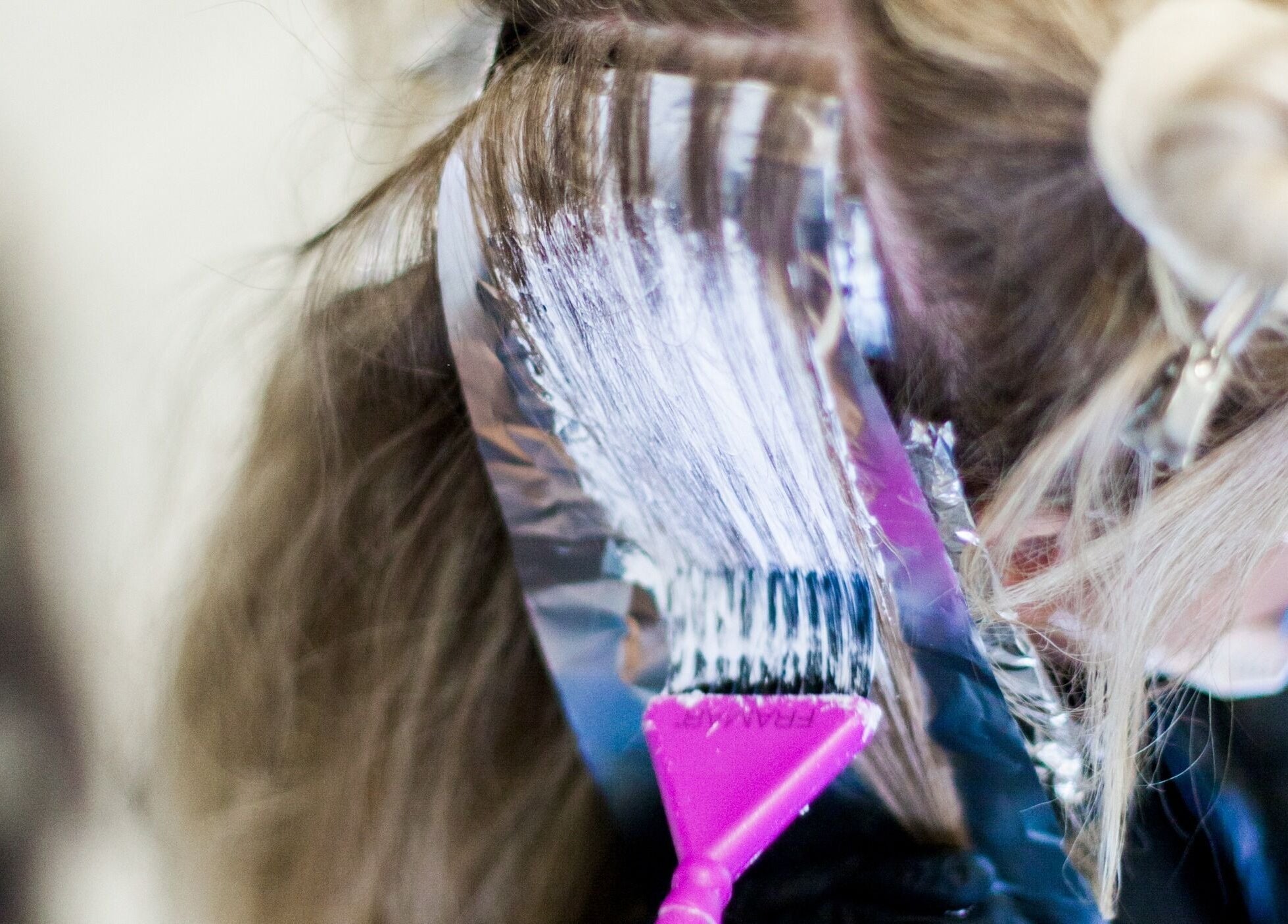 Close-up of hair highlighting at Blush + Blow London, London, England, GB, showcasing expert hair coloring.