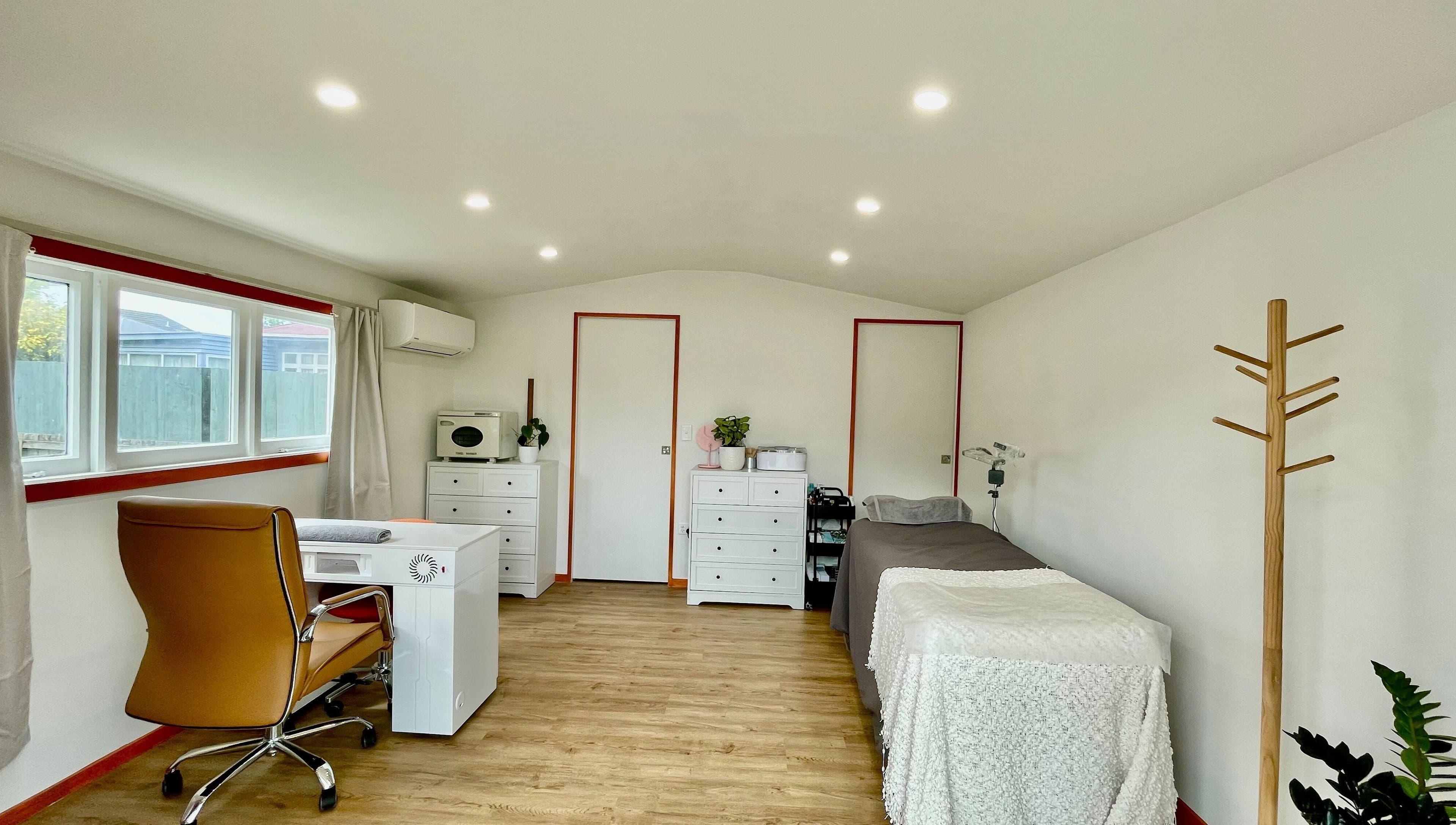 Elegant treatment room at Mercury Beauty Studio, Christchurch, Canterbury, NZ with cozy ambience.
