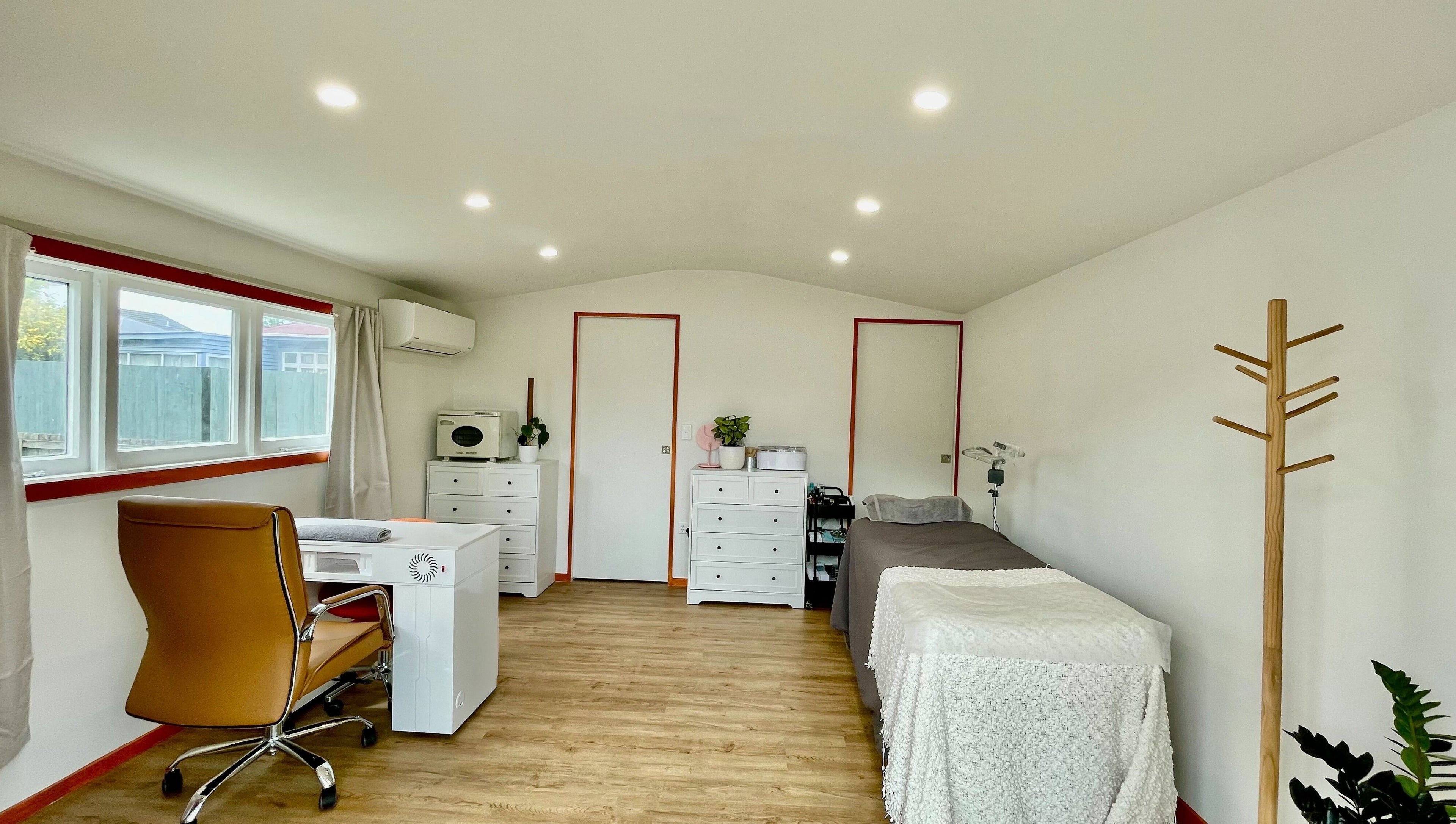 Elegant treatment room at Mercury Beauty Studio, Christchurch, Canterbury, NZ with cozy ambience.