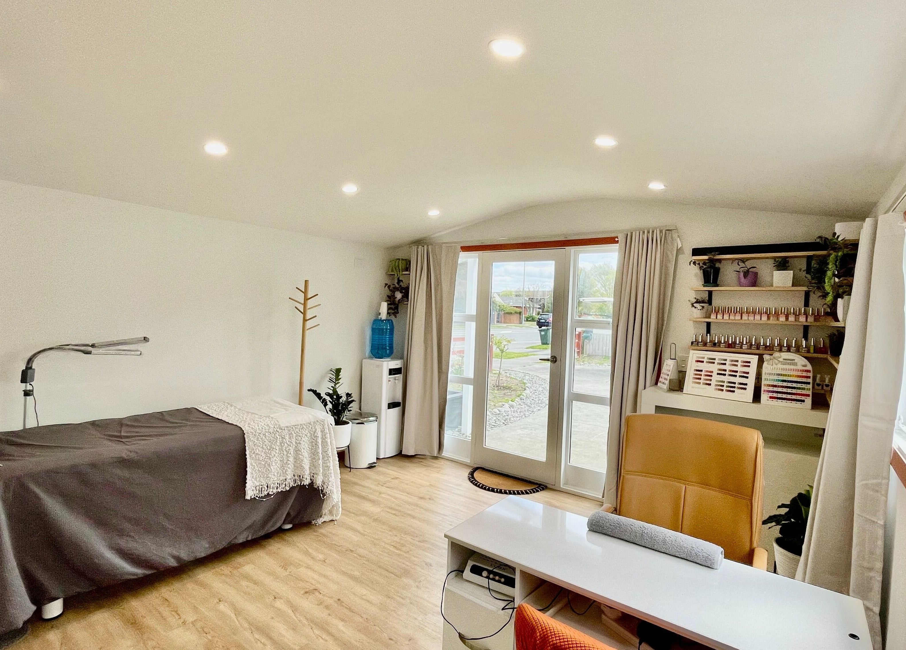 Calming beauty room at Mercury Beauty Studio, Christchurch, Canterbury, NZ with a cozy bed and natural light.
