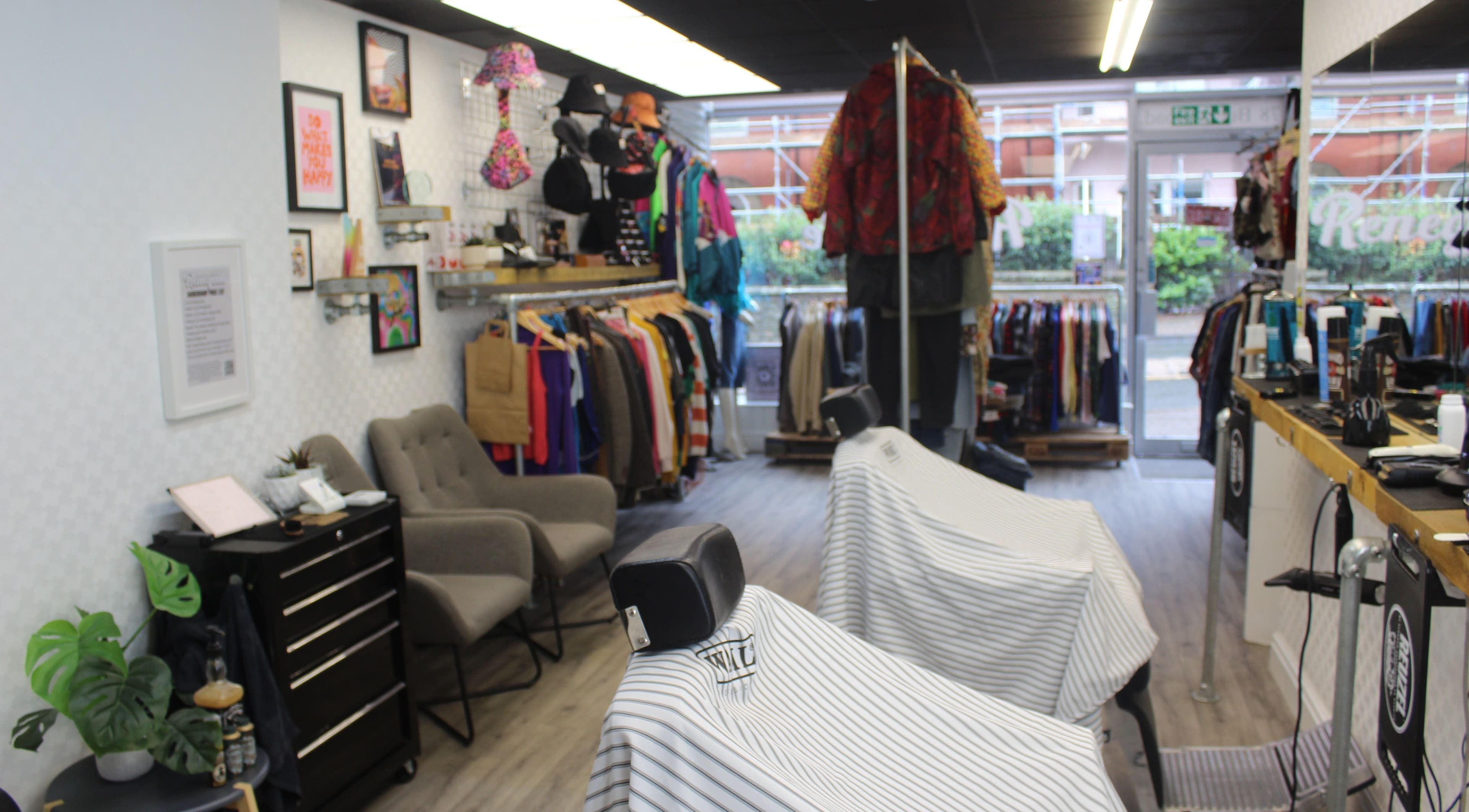 Interior of Renegade: Cuts and Clobber, Douglas, showcasing stylish decor and vintage garments.