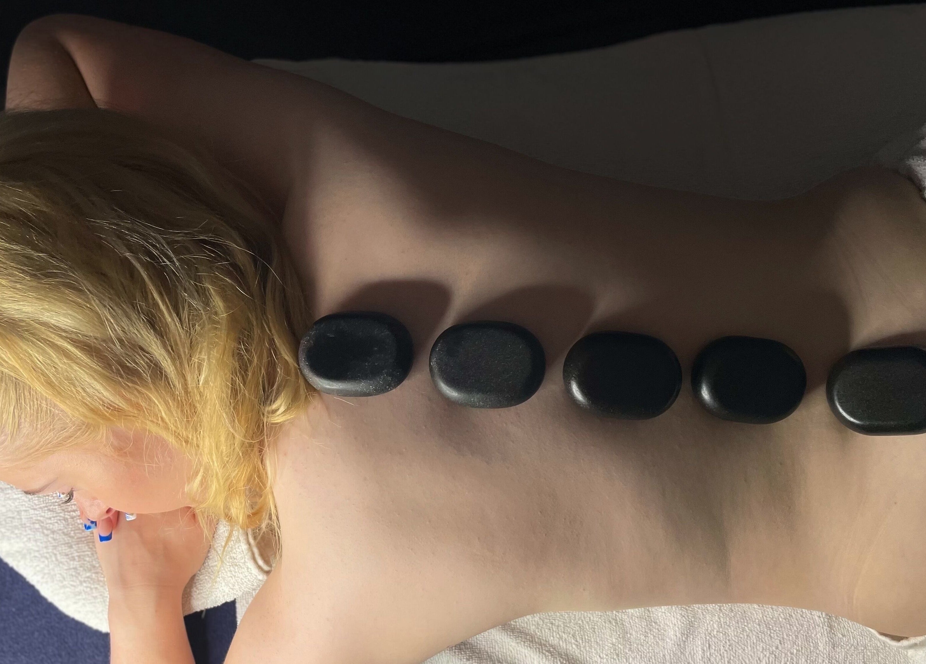 Hot stone therapy at The Secret Garden Spa, Weymouth, England, GB promotes relaxation and wellness.