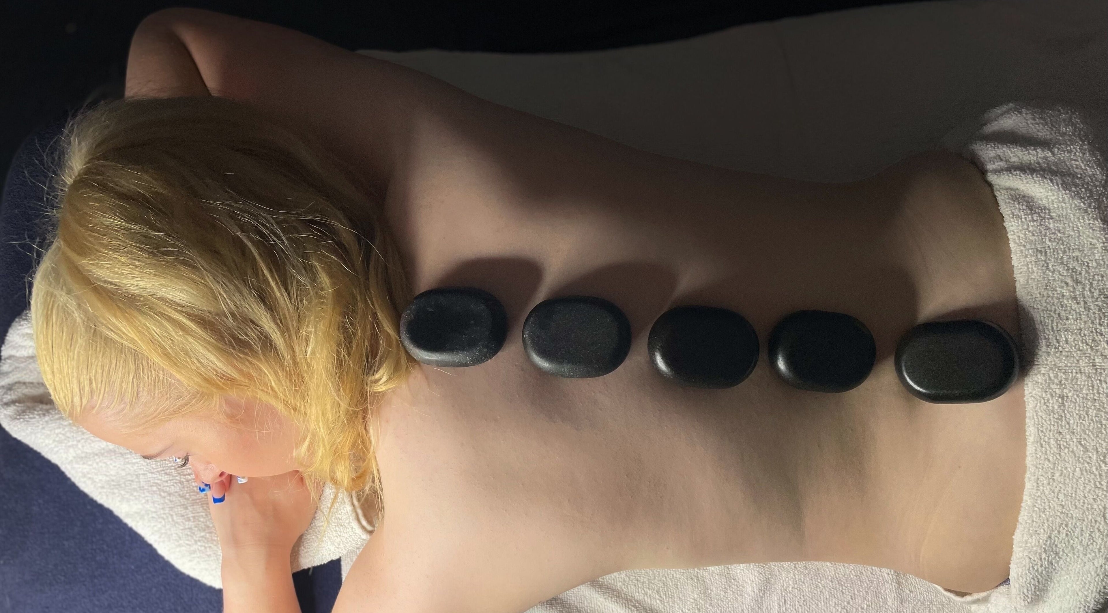 Hot stone therapy at The Secret Garden Spa, Weymouth, England, GB promotes relaxation and wellness.