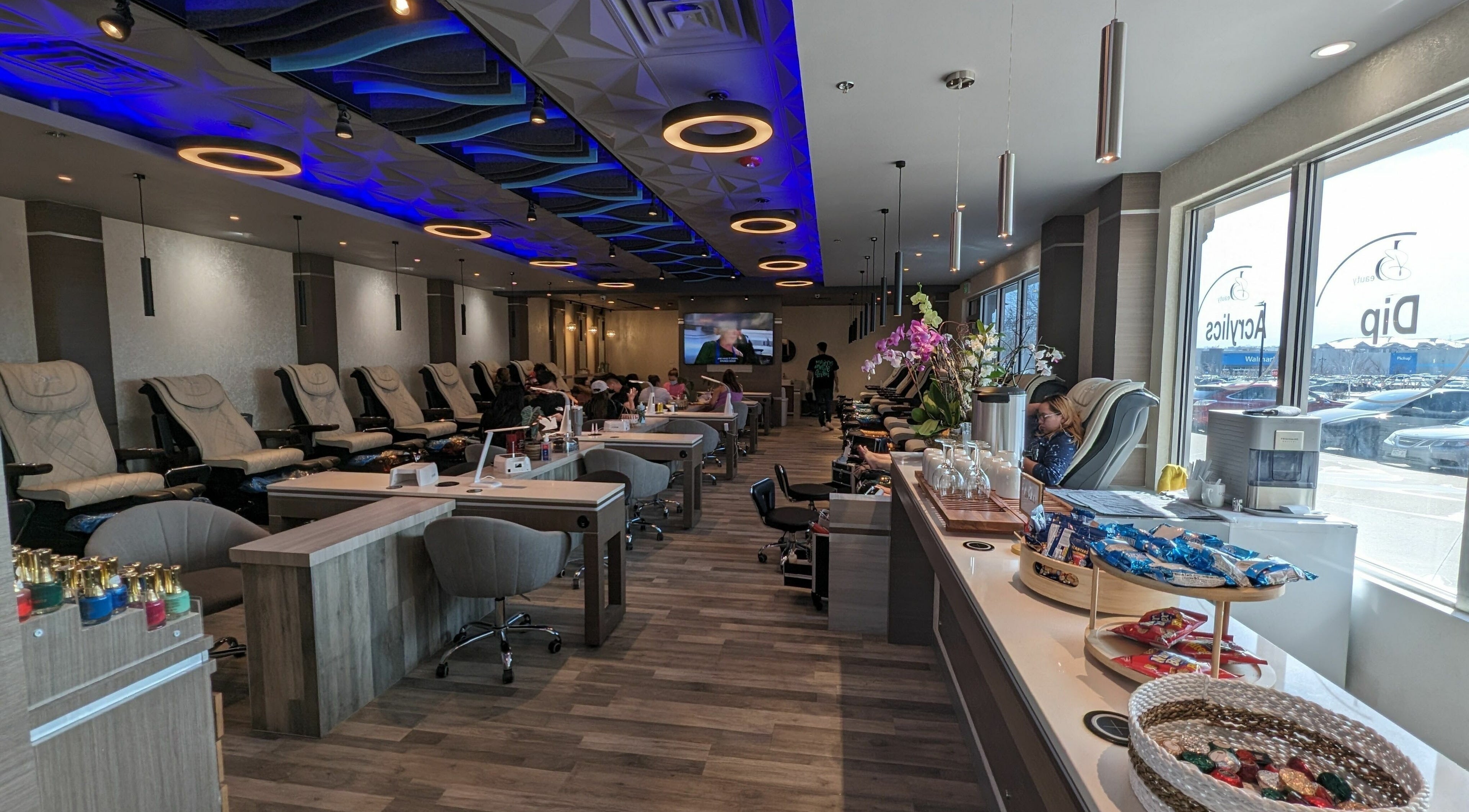 Interior of Be Beauty Nails and Spa in Littleton, Colorado, US featuring luxurious nail stations and ambient lighting.