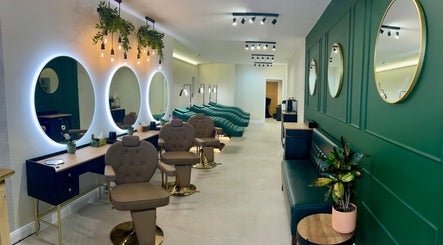 Elegant interior of London Lash Lounge Hammersmith, London, England with plush seating and decorative mirrors.