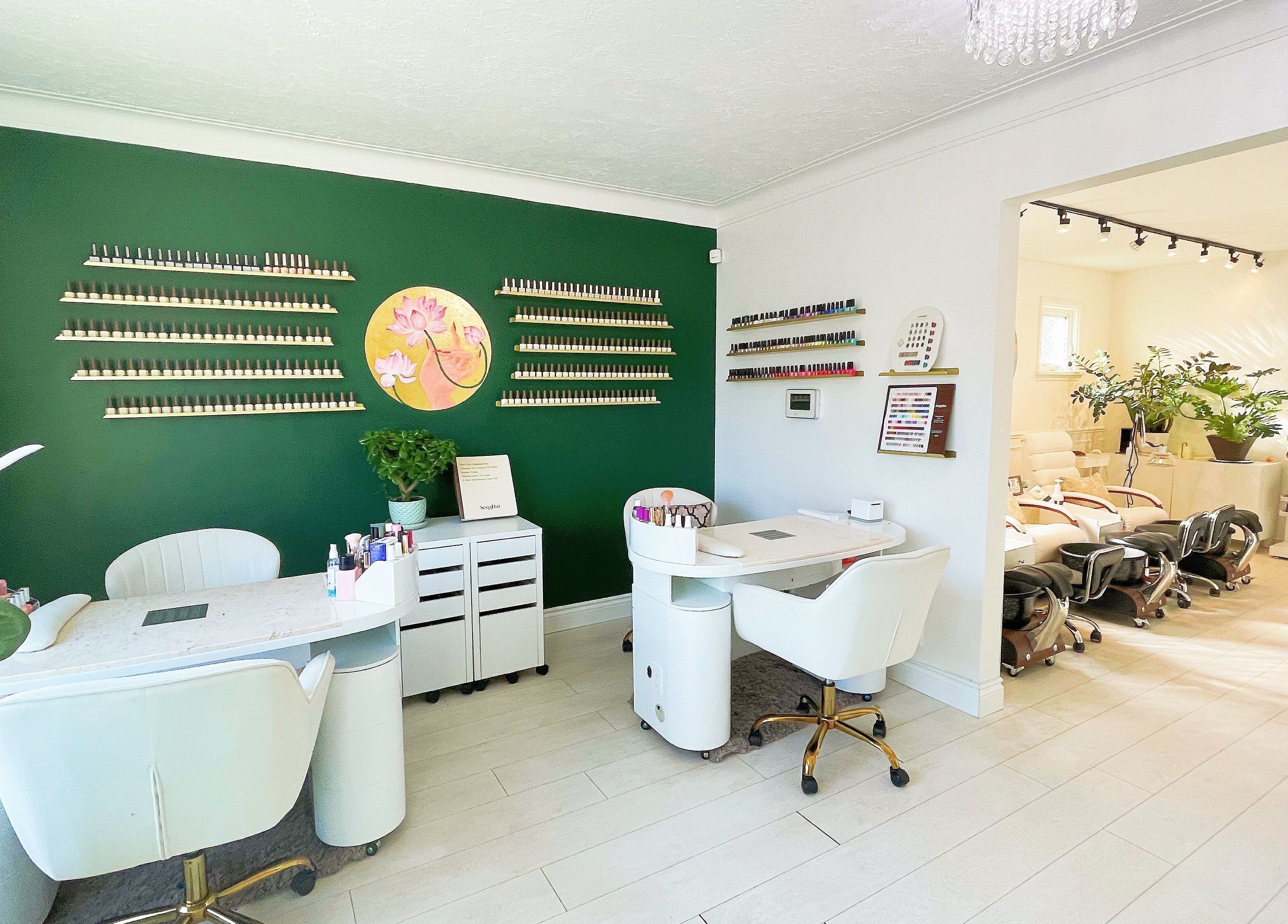Elegant nail salon at SPA OJAS, Winnipeg, Manitoba, CA featuring stylish manicure stations.