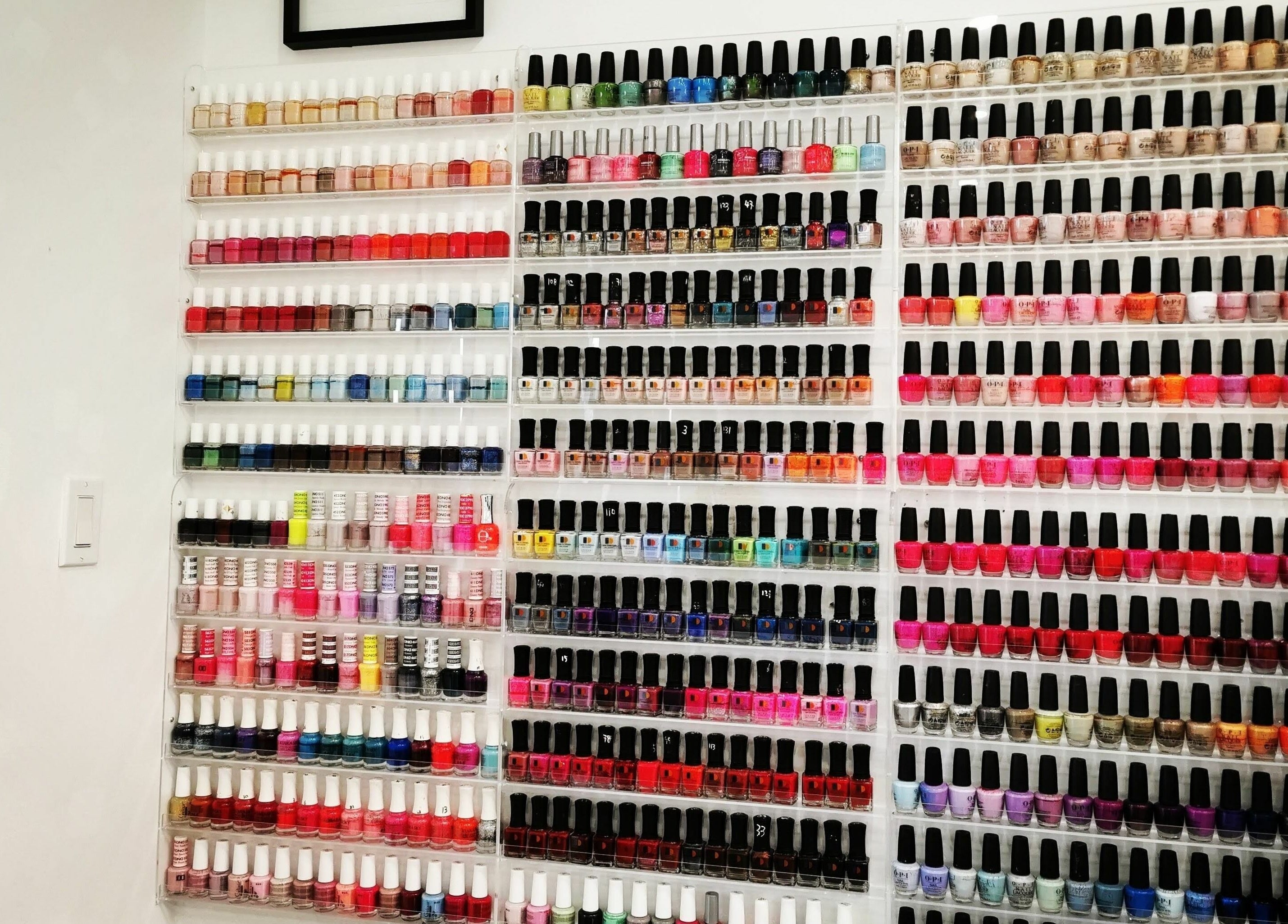 Colorful nail polish display at Fancy Nails & Spa, Cobourg, Ontario, CA.