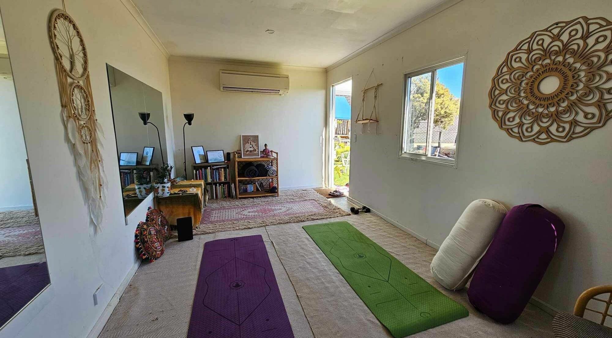 Calm yoga room with mats at Essence Wellbeing - Seaford, South Australia, AU, offers tranquility and relaxation.