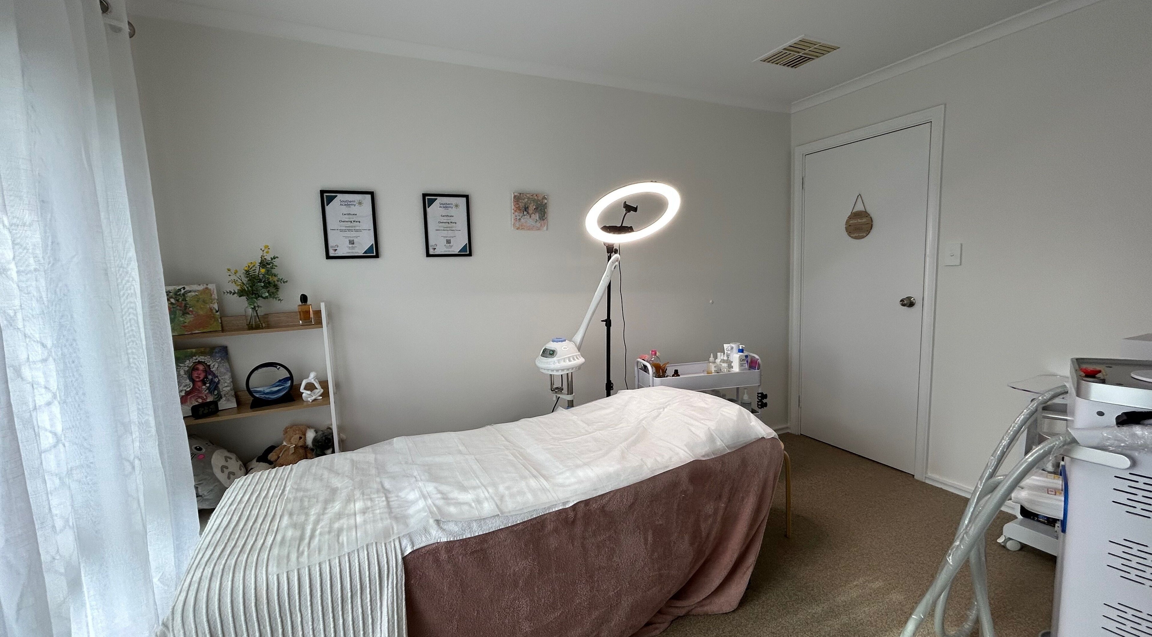 Calm treatment room at Bella Beauty Studio in Leeming, Western Australia, AU, featuring cozy bed and soft lighting.