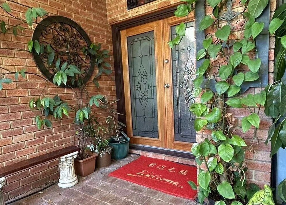 Entrance to Bella Beauty Studio in Leeming, Western Australia, AU, with vibrant plants and a welcoming mat.