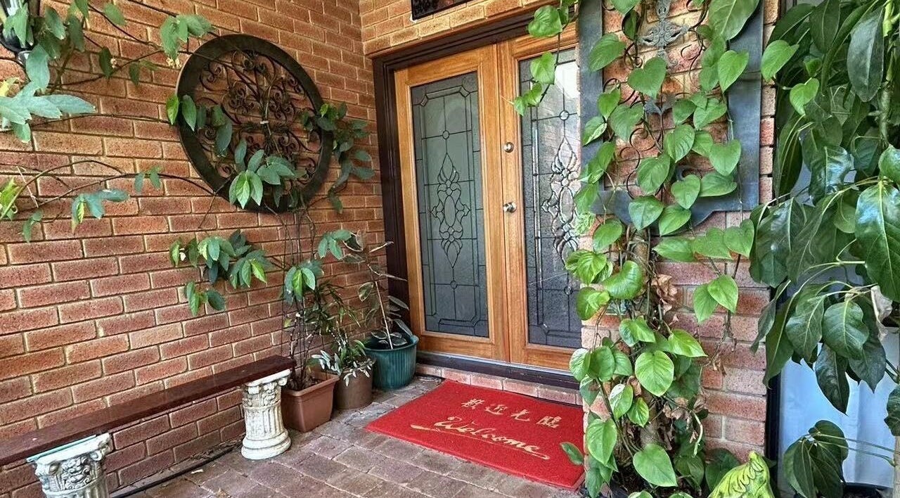 Entrance to Bella Beauty Studio in Leeming, Western Australia, AU, with vibrant plants and a welcoming mat.