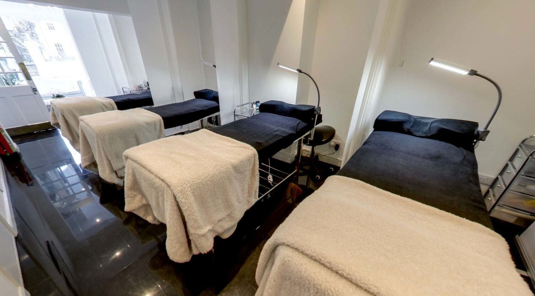 Cozy treatment room with four beds at Inga Lash and Co, Maidstone, England, GB. Ideal for relaxing beauty sessions.