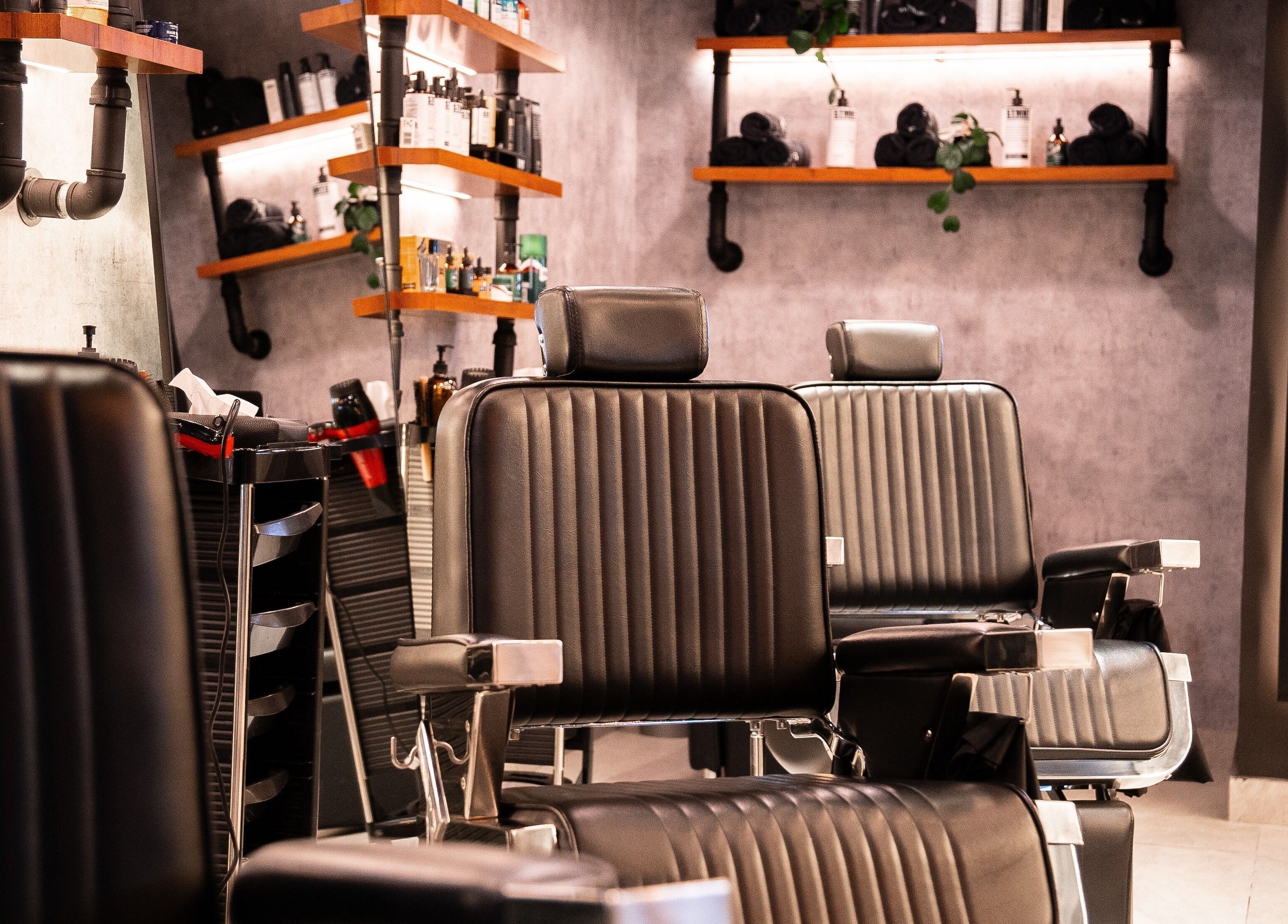 Modern barber chairs at Backyard Barbers in أبو ظبي, أبو ظبي, AE, showcasing stylish, comfortable seating.