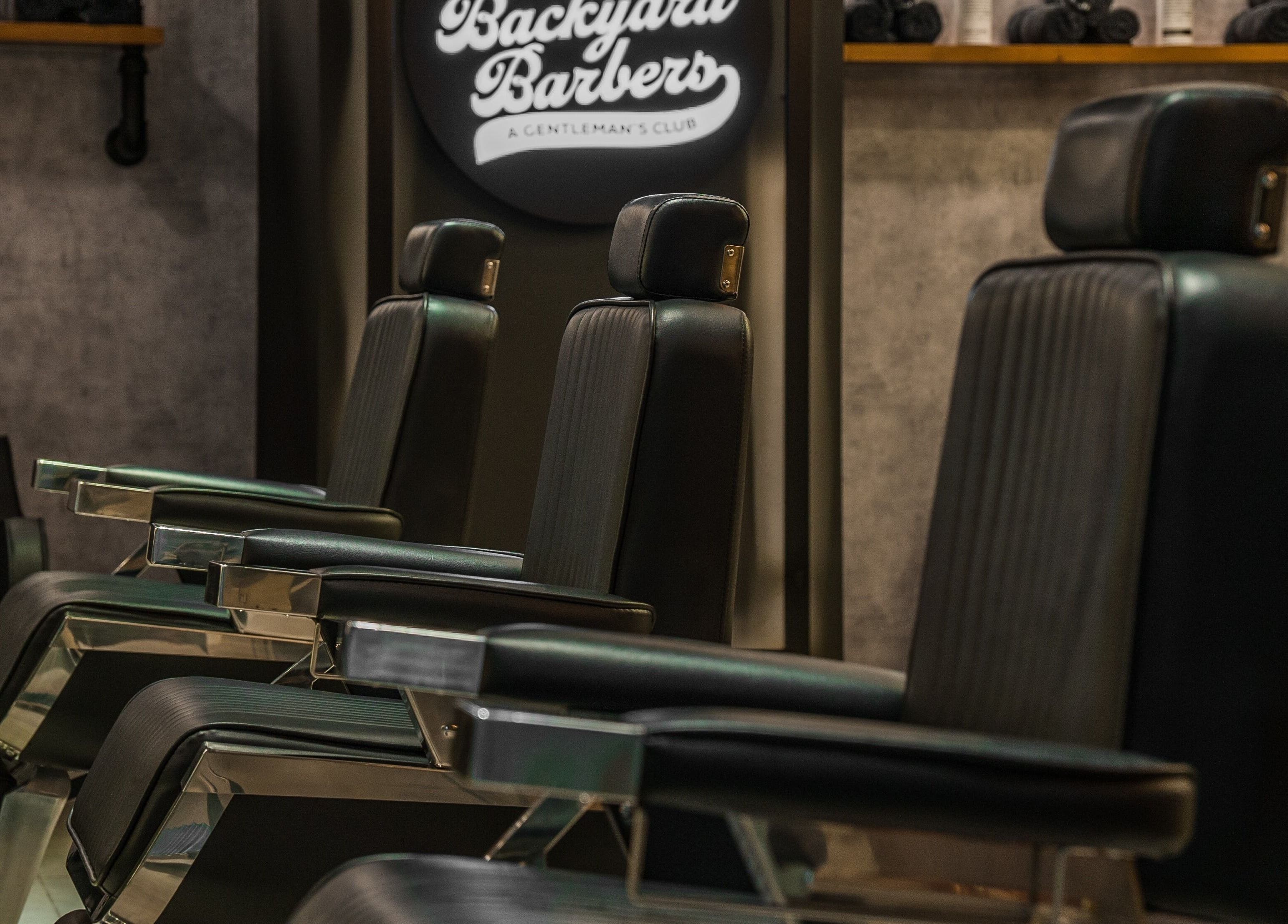 Luxurious barber chairs at Backyard Barbers, أبو ظبي, أبو ظبي, AE, showcasing comfort and style.