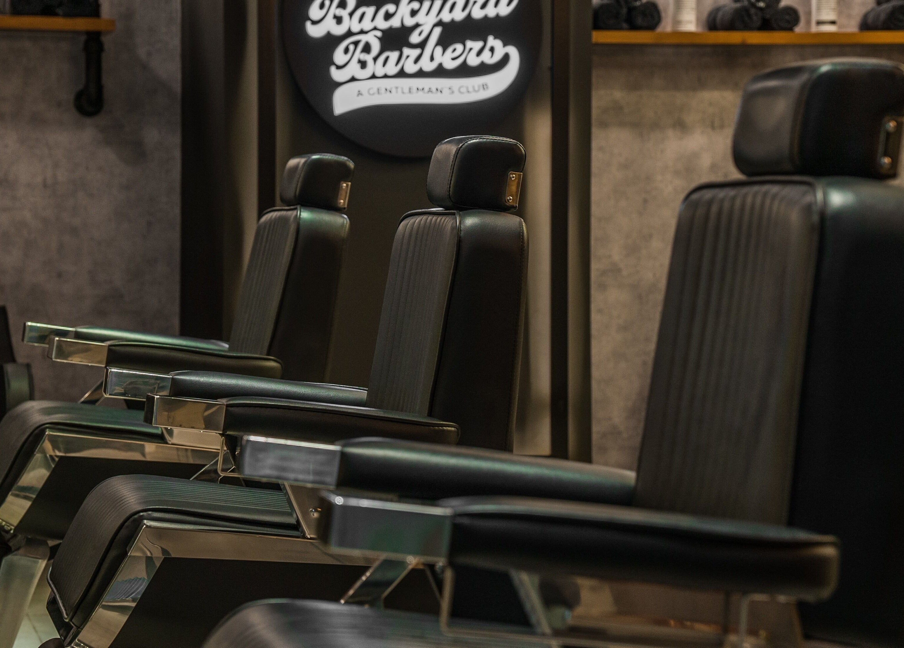 Luxurious barber chairs at Backyard Barbers, أبو ظبي, أبو ظبي, AE, showcasing comfort and style.
