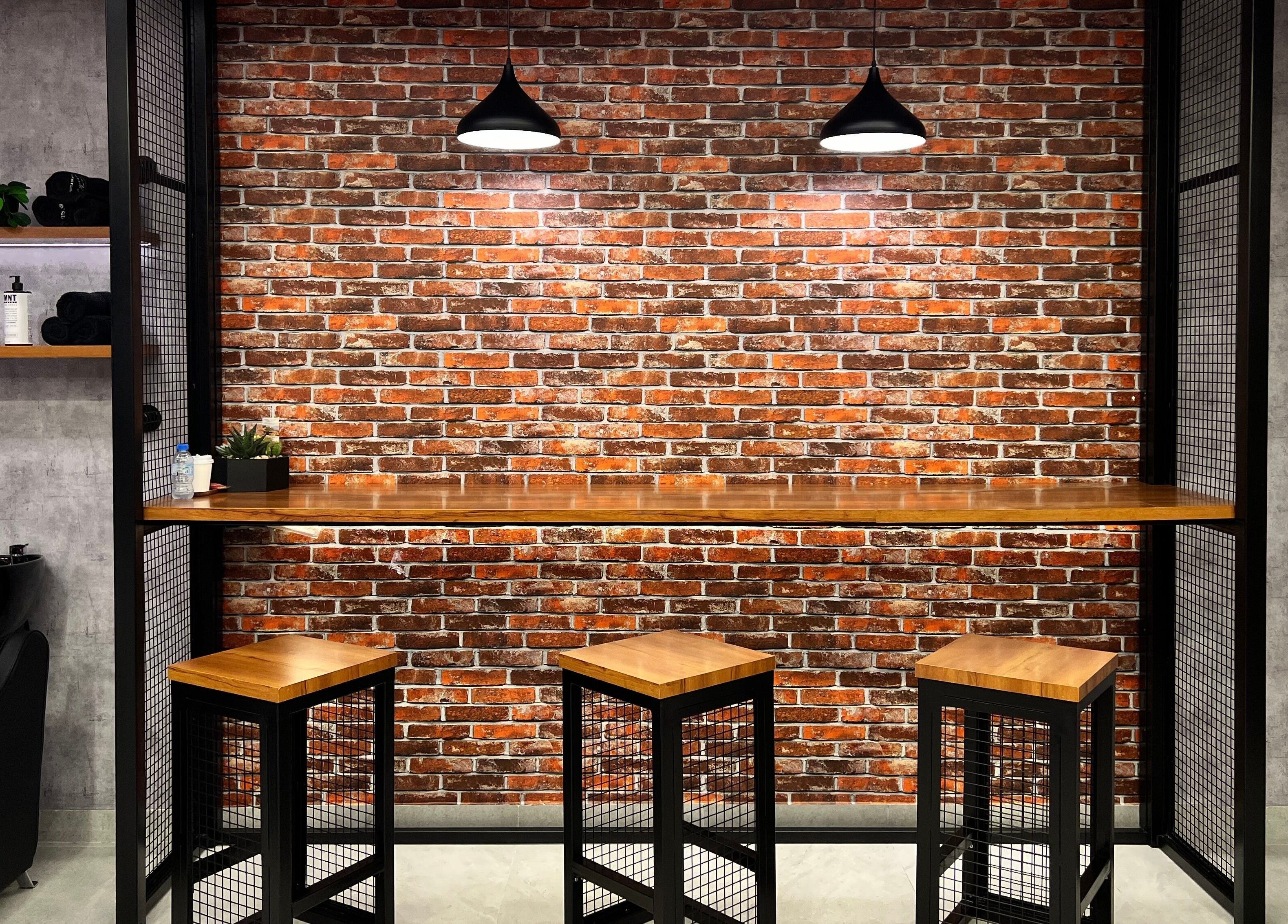 Chic barber station at Backyard Barbers in أبو ظبي, أبو ظبي, AE, featuring stylish seating and decor.