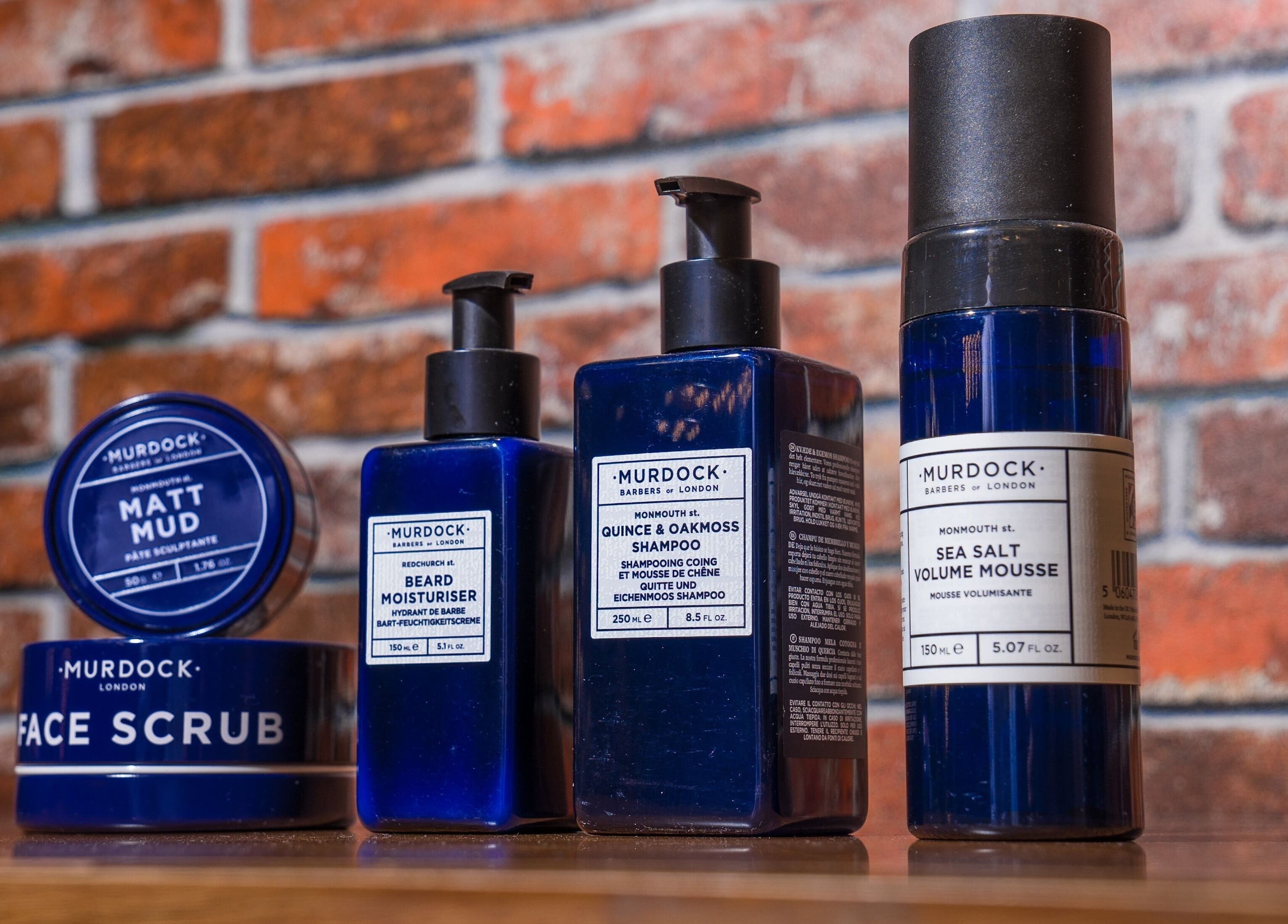 Grooming products at Backyard Barbers, أبو ظبي, أبو ظبي, AE showcasing matt mud, face scrub, and shampoo.