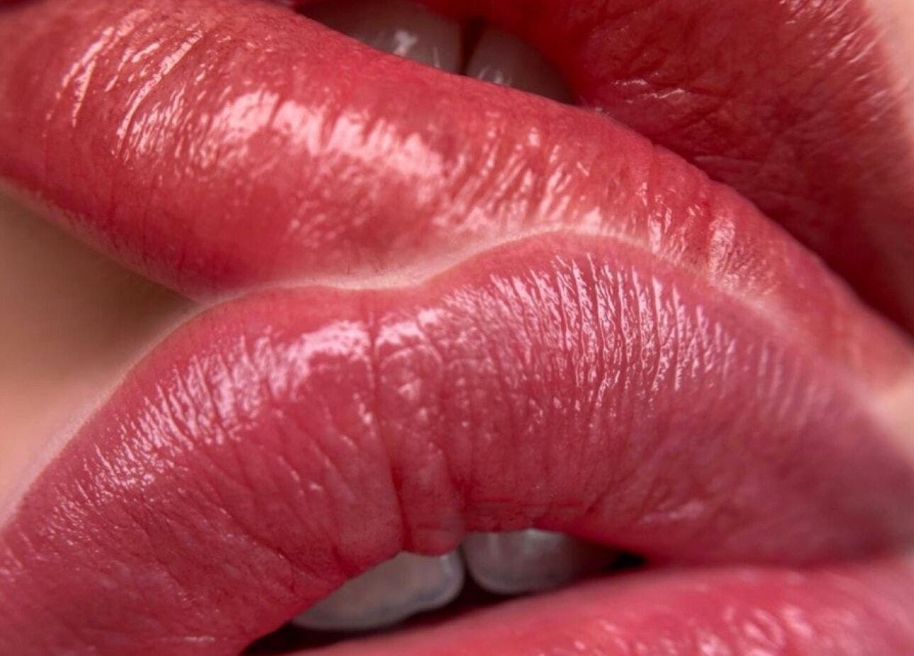 Close-up of glossy pink lips at Francieli Fabri PMU, Woking, England, GB.