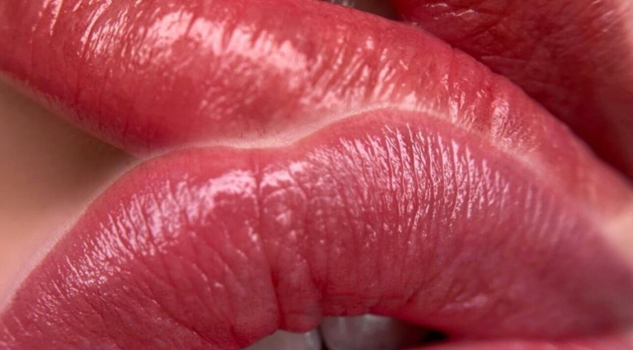 Close-up of glossy pink lips at Francieli Fabri PMU, Woking, England, GB.