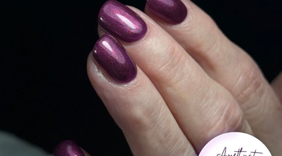Vibrant purple manicure at Amethyst Beauty, Westhill, Scotland, GB, showcasing exquisite nail art.