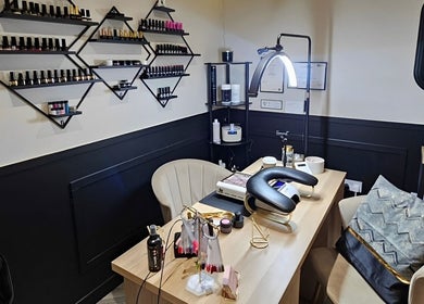 Cozy nail service area with polish display at Scarra Beauty, Oban, Scotland, GB.
