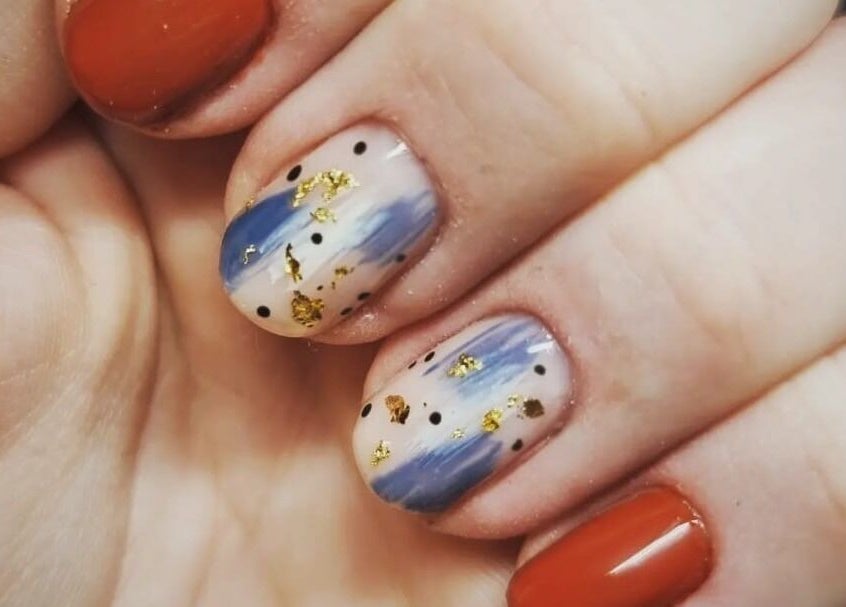 Unique nail art with blue brush strokes at Scarra Beauty, Oban, Scotland, GB.