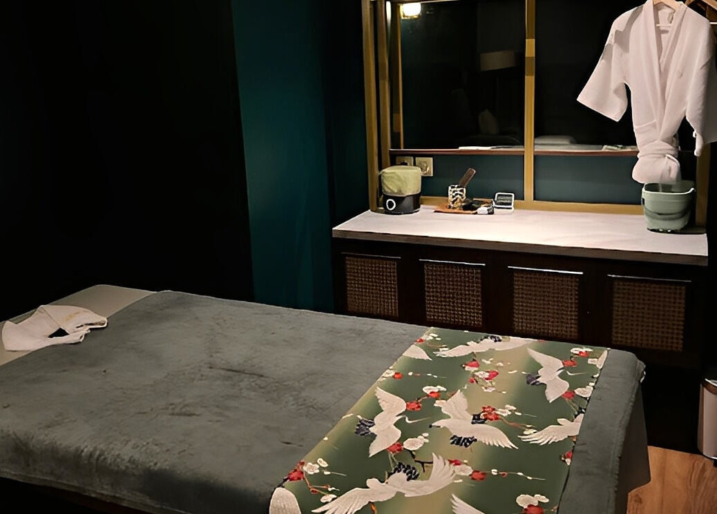 Relaxing treatment room at Ame Spa Thamrin, Daerah Khusus Ibukota Jakarta, ID, featuring comfy massage table.