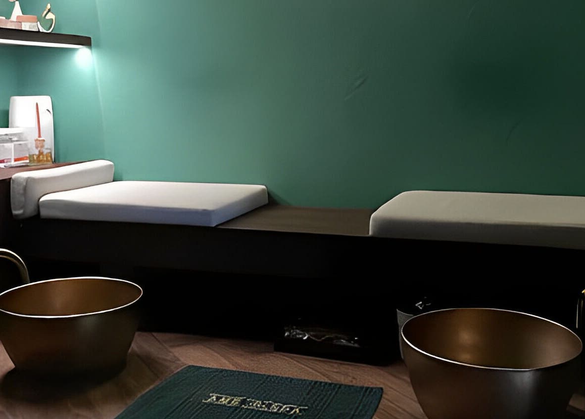 Tranquil treatment room at Ame Spa Thamrin in Daerah Khusus Ibukota Jakarta featuring cozy beds and warm decor.