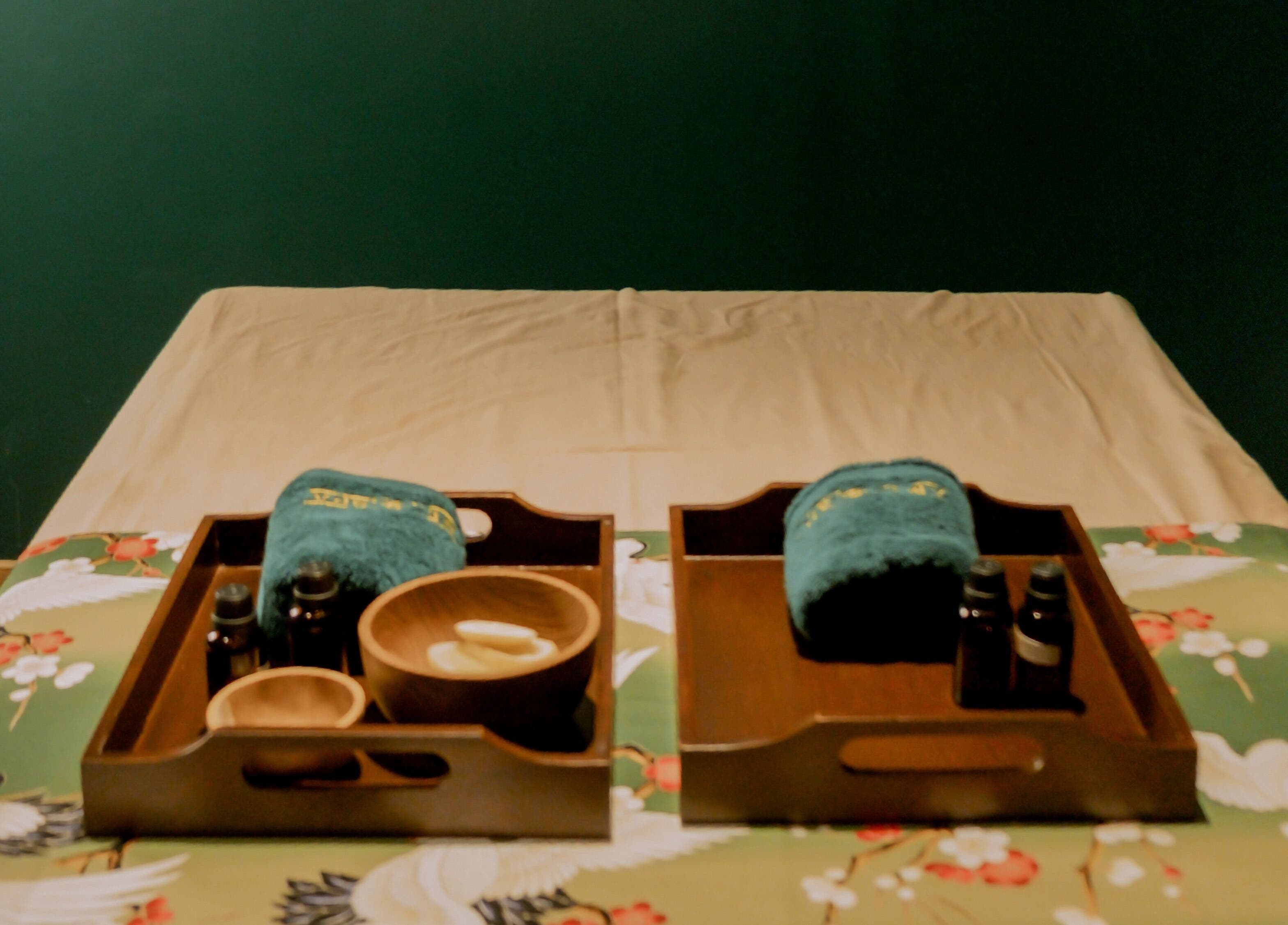 Relaxing spa setup at Ame Spa Thamrin, Daerah Khusus Ibukota Jakarta, ID with oils and towels on a massage bed.