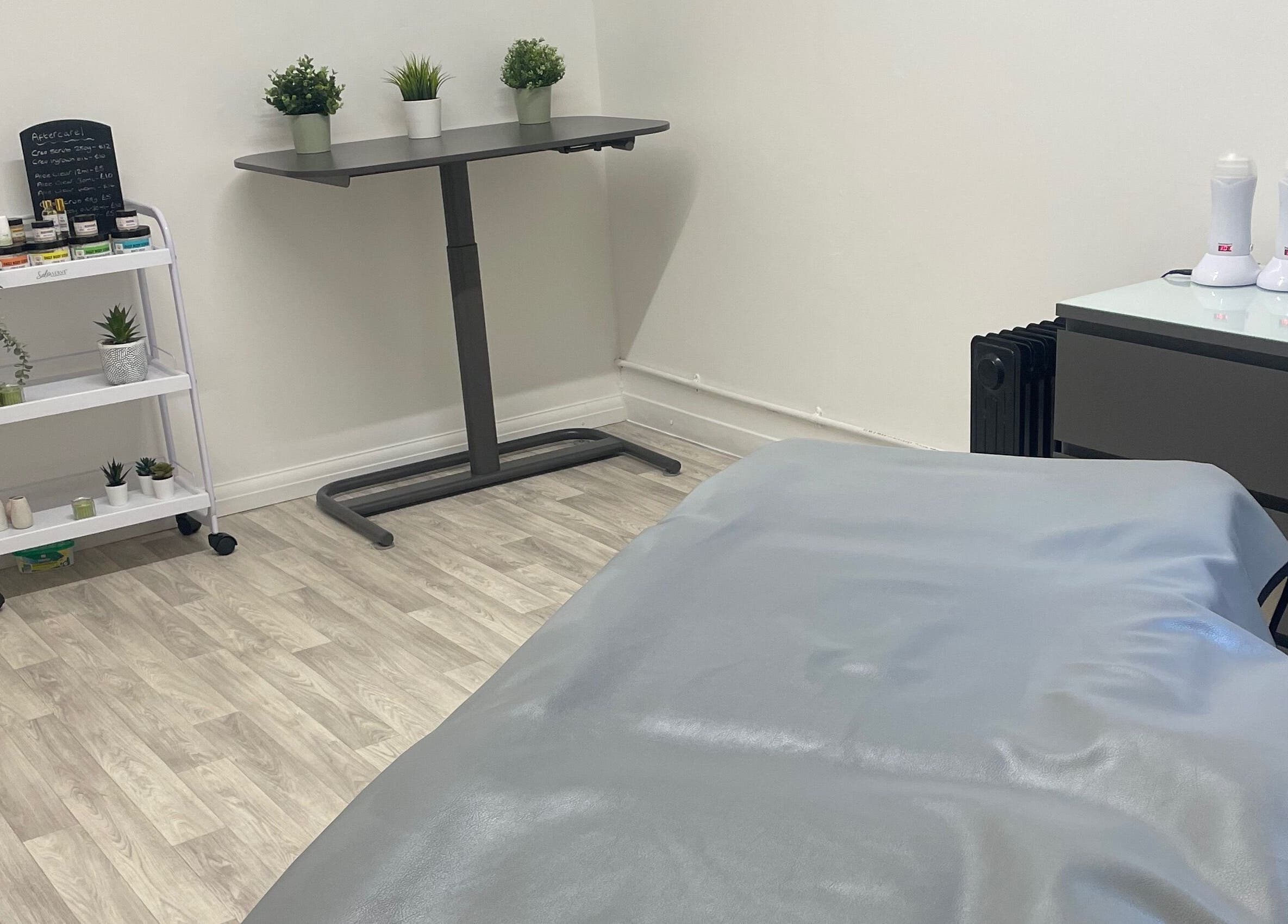 Serene spa room at Wax with Hazel - Intimate Wax Specialist in Wellingborough, England, GB, showcasing a waxing table.