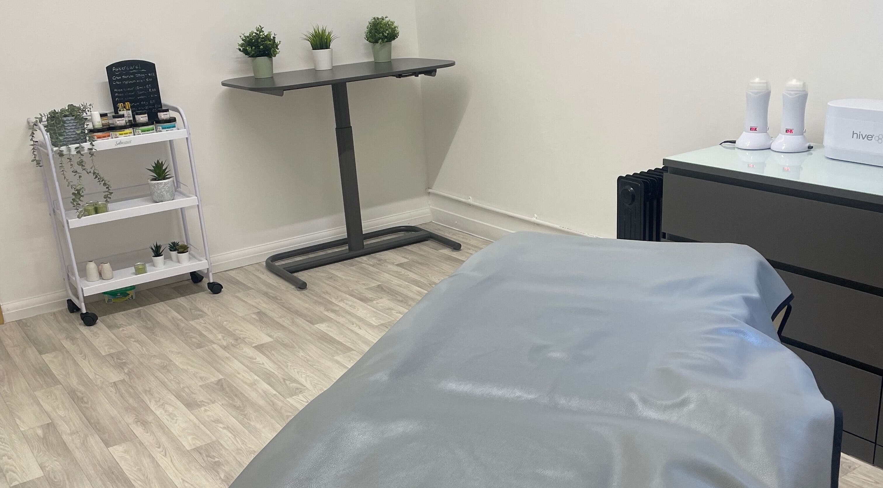 Serene spa room at Wax with Hazel - Intimate Wax Specialist in Wellingborough, England, GB, showcasing a waxing table.