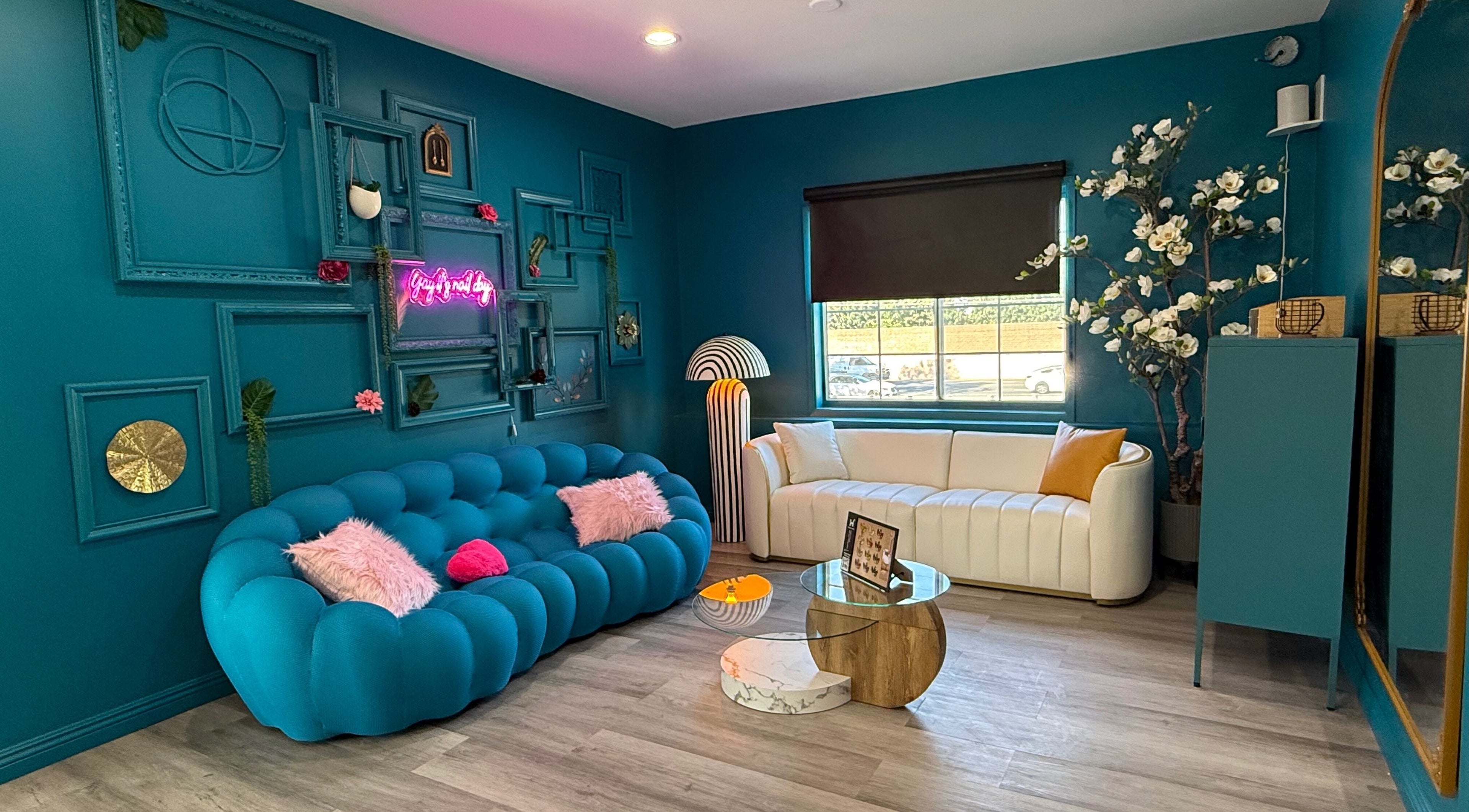 Trendy seating area at Blink Nail Spa Woodland Hills, Los Angeles, California, US with vibrant decor.