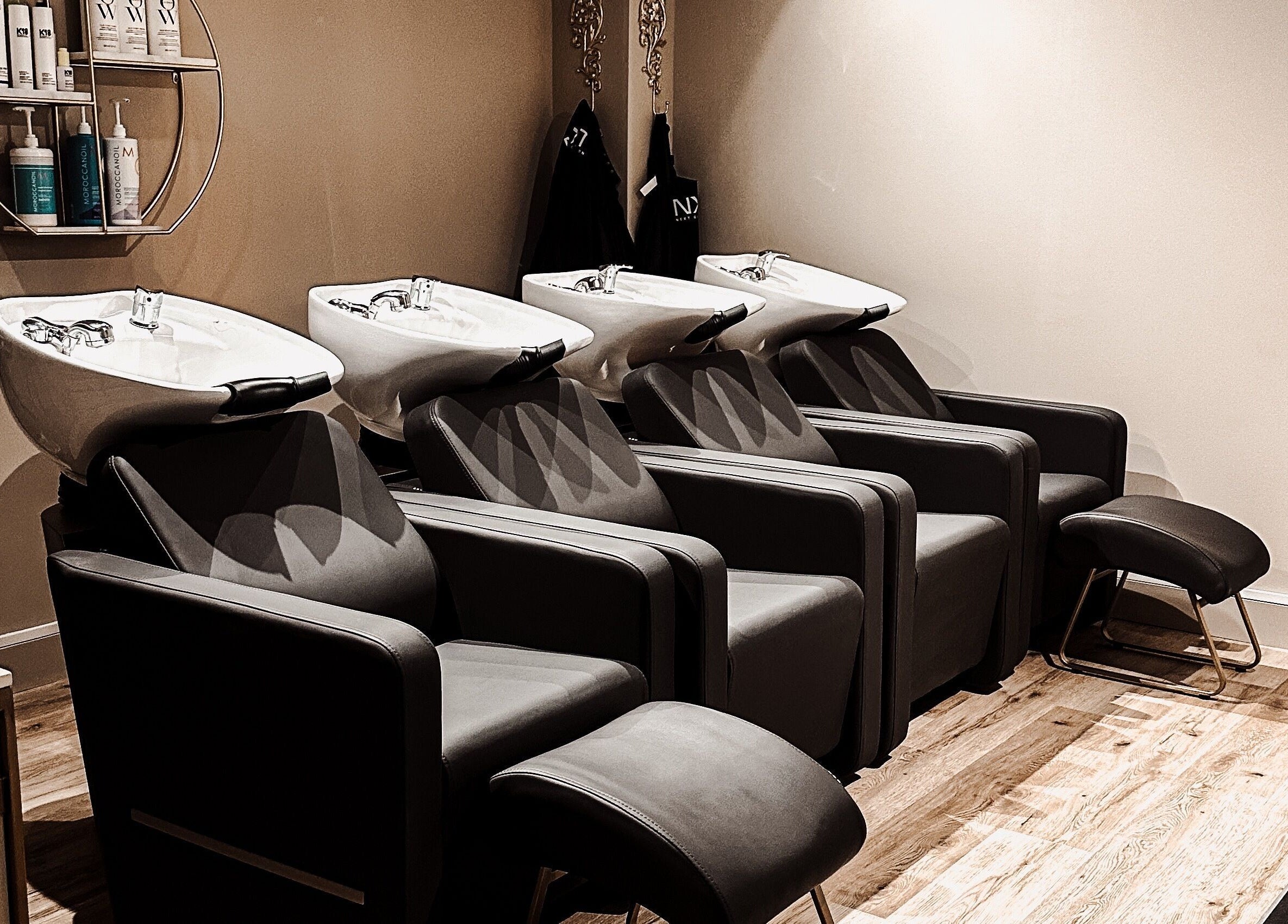 Sleek salon wash stations at Blossom, Neath, Wales, GB. Modern design enhances beauty and wellness experience.