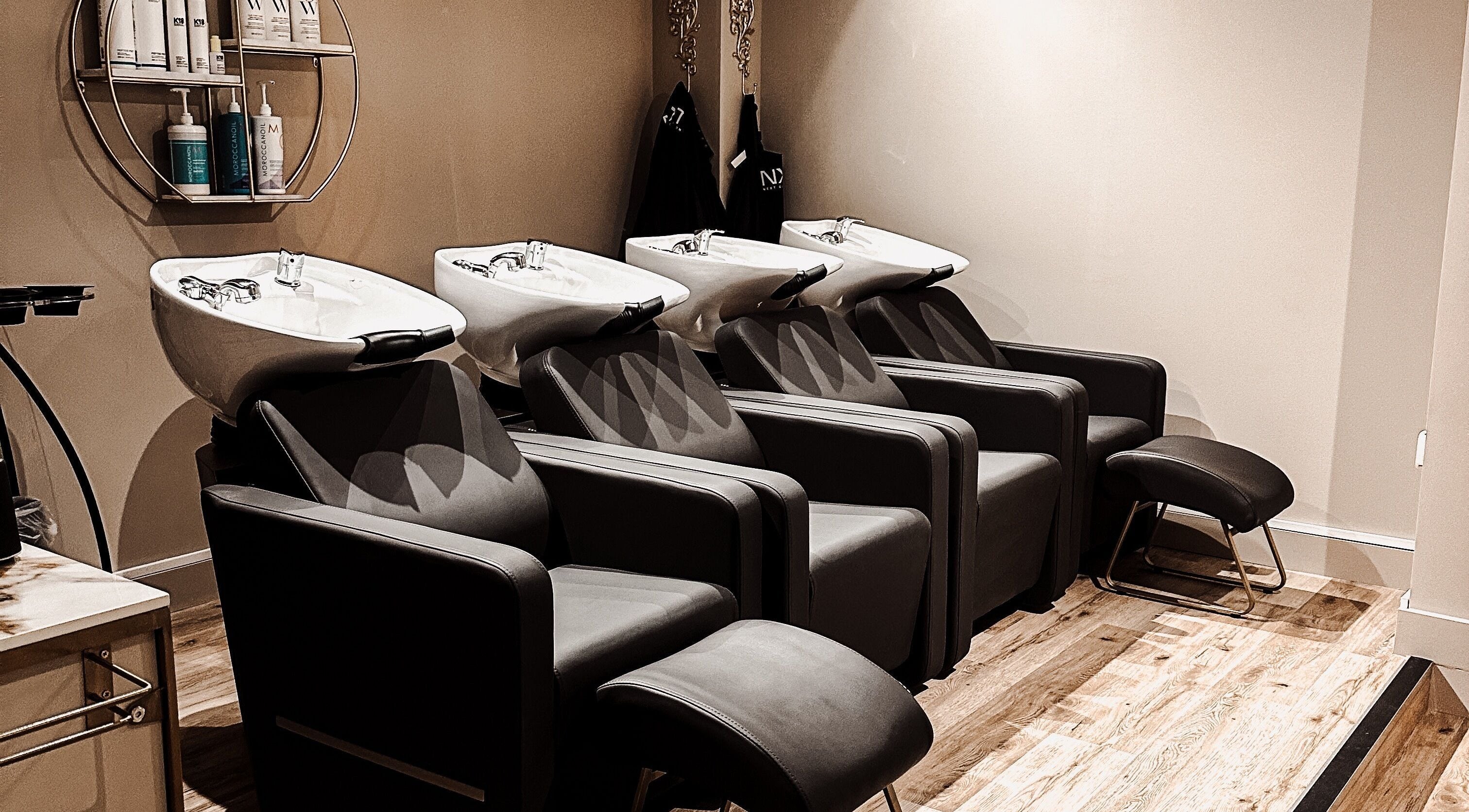 Sleek salon wash stations at Blossom, Neath, Wales, GB. Modern design enhances beauty and wellness experience.