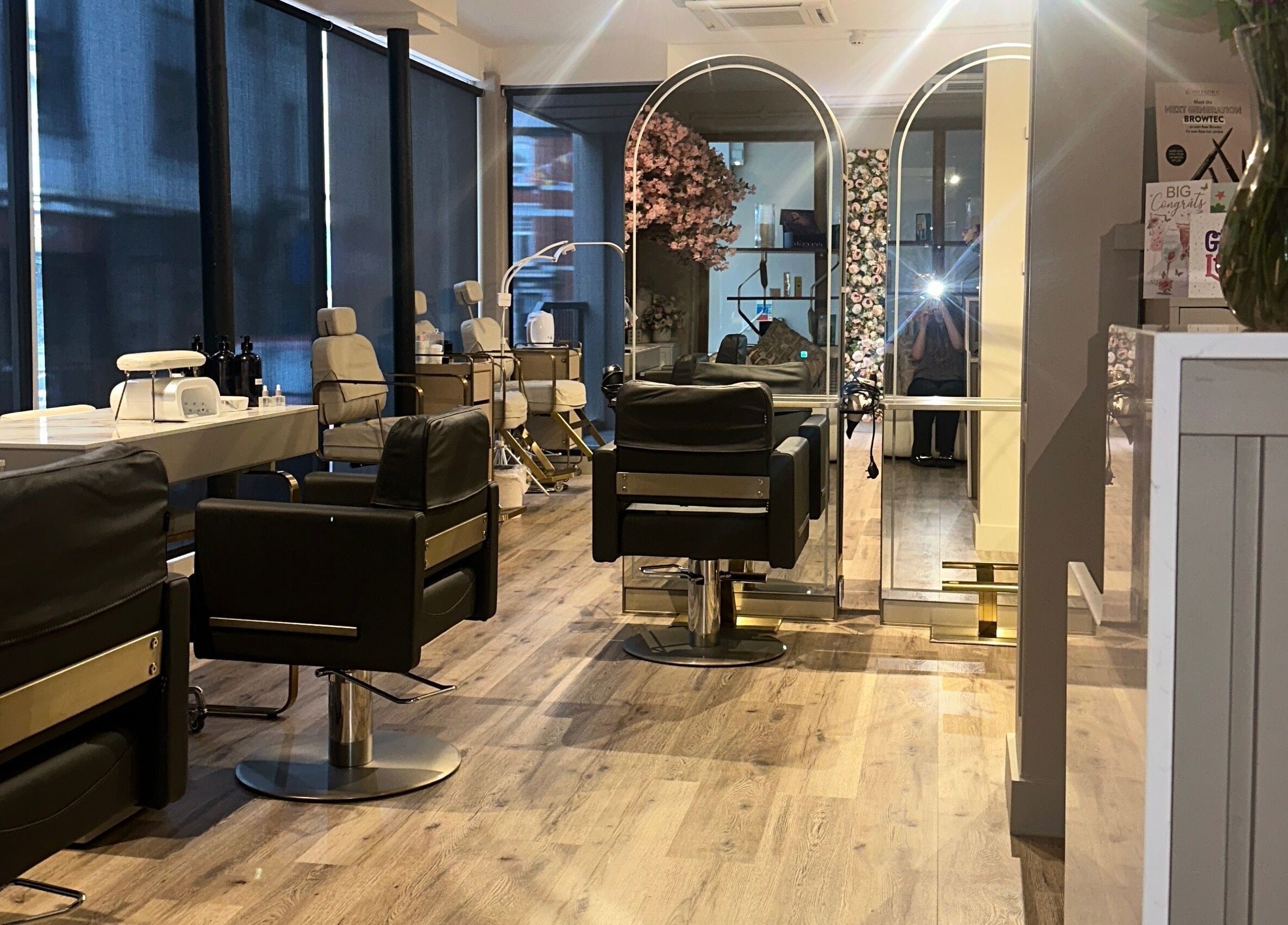 Chic salon interior at Blossom, Neath, Wales, GB featuring luxurious chairs and stylish decor.