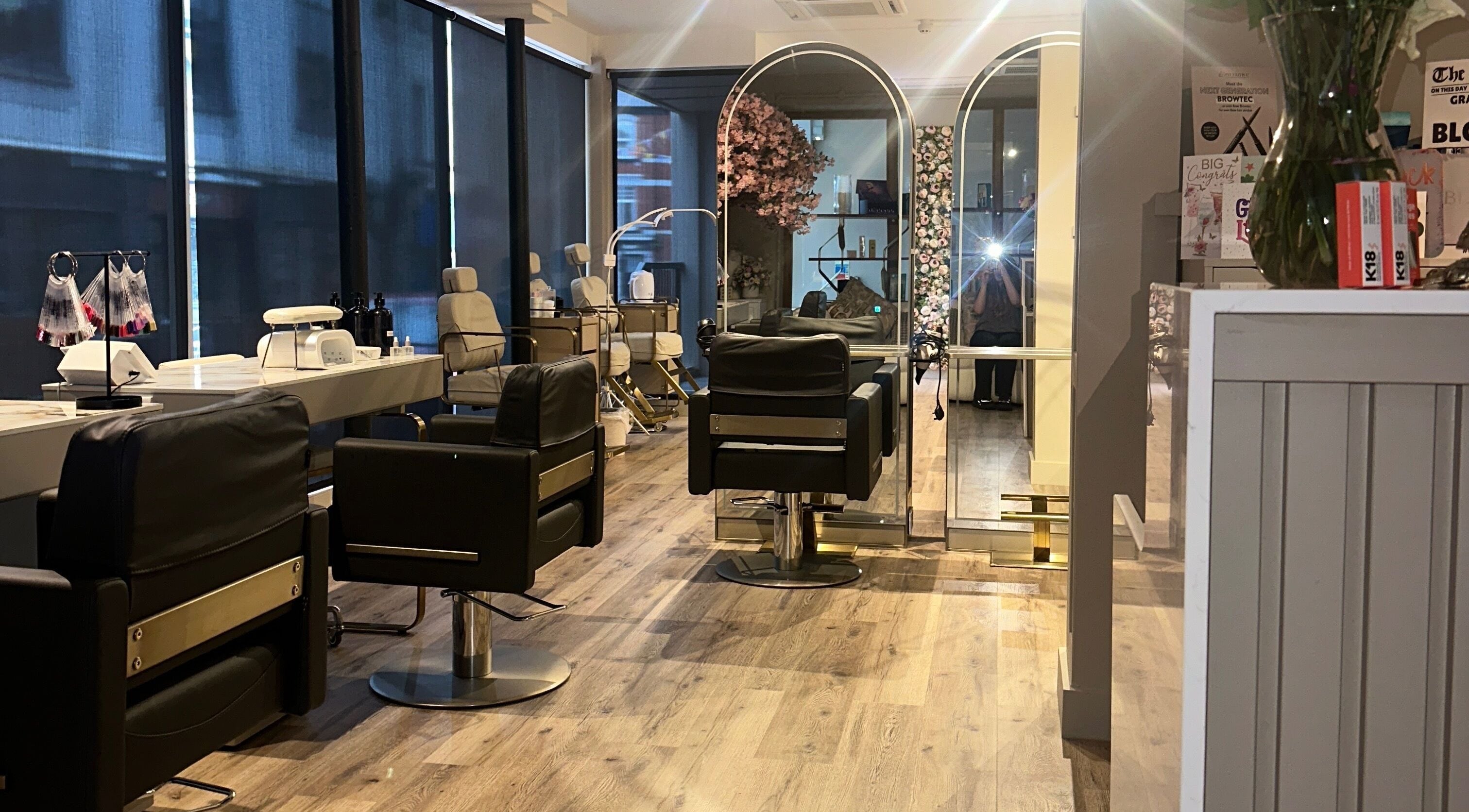 Chic salon interior at Blossom, Neath, Wales, GB featuring luxurious chairs and stylish decor.