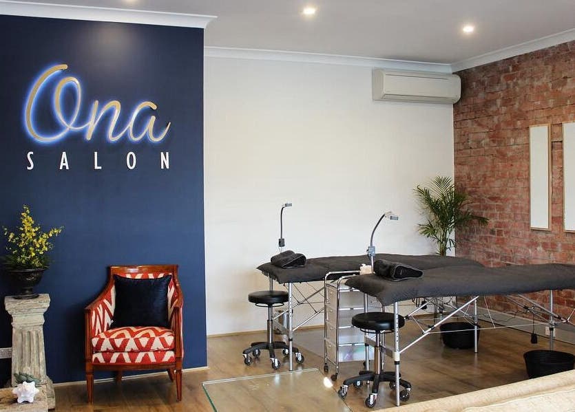 Interior of Ona Lash and Brow Bar, Melbourne, Victoria, AU, featuring modern beds and stylish decor.