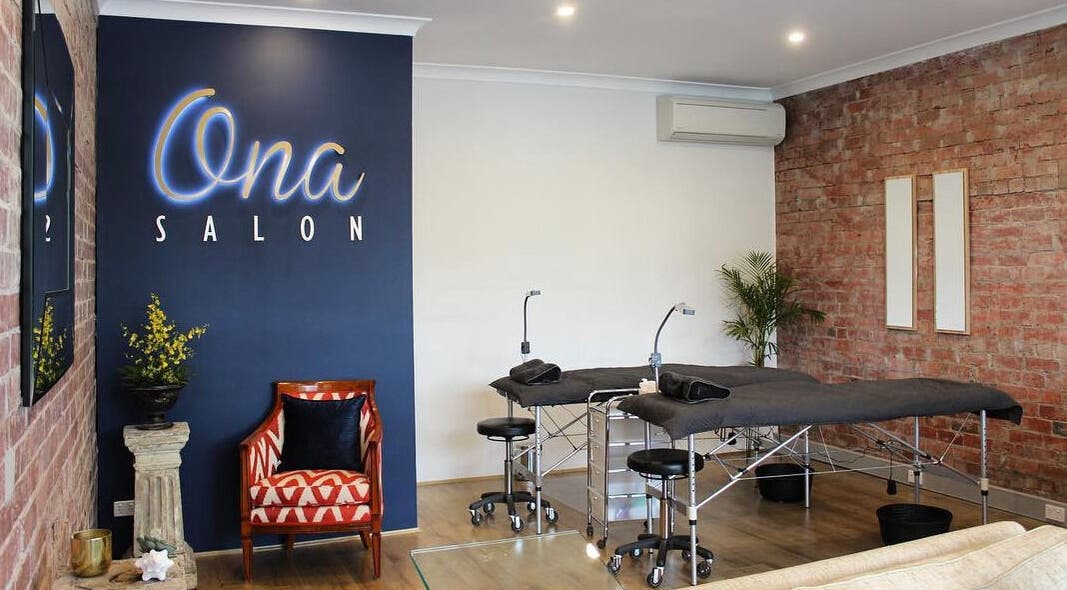 Interior of Ona Lash and Brow Bar, Melbourne, Victoria, AU, featuring modern beds and stylish decor.