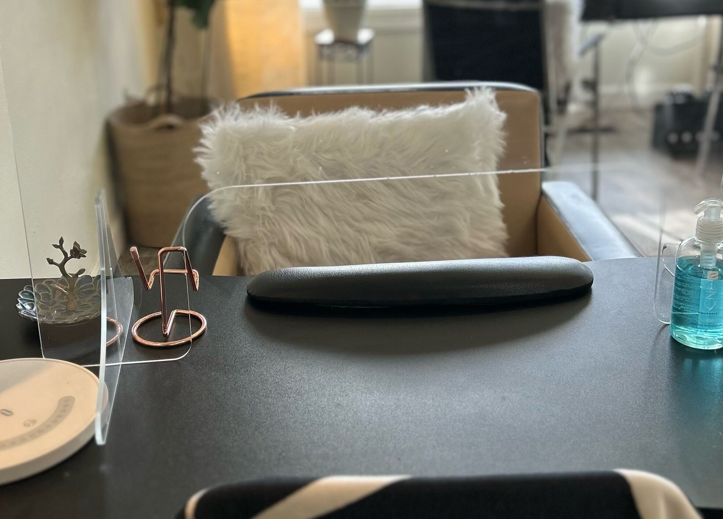 Modern nail station setup at Nails Essential Spa in Cohasset, Massachusetts, US, offering a relaxing experience.