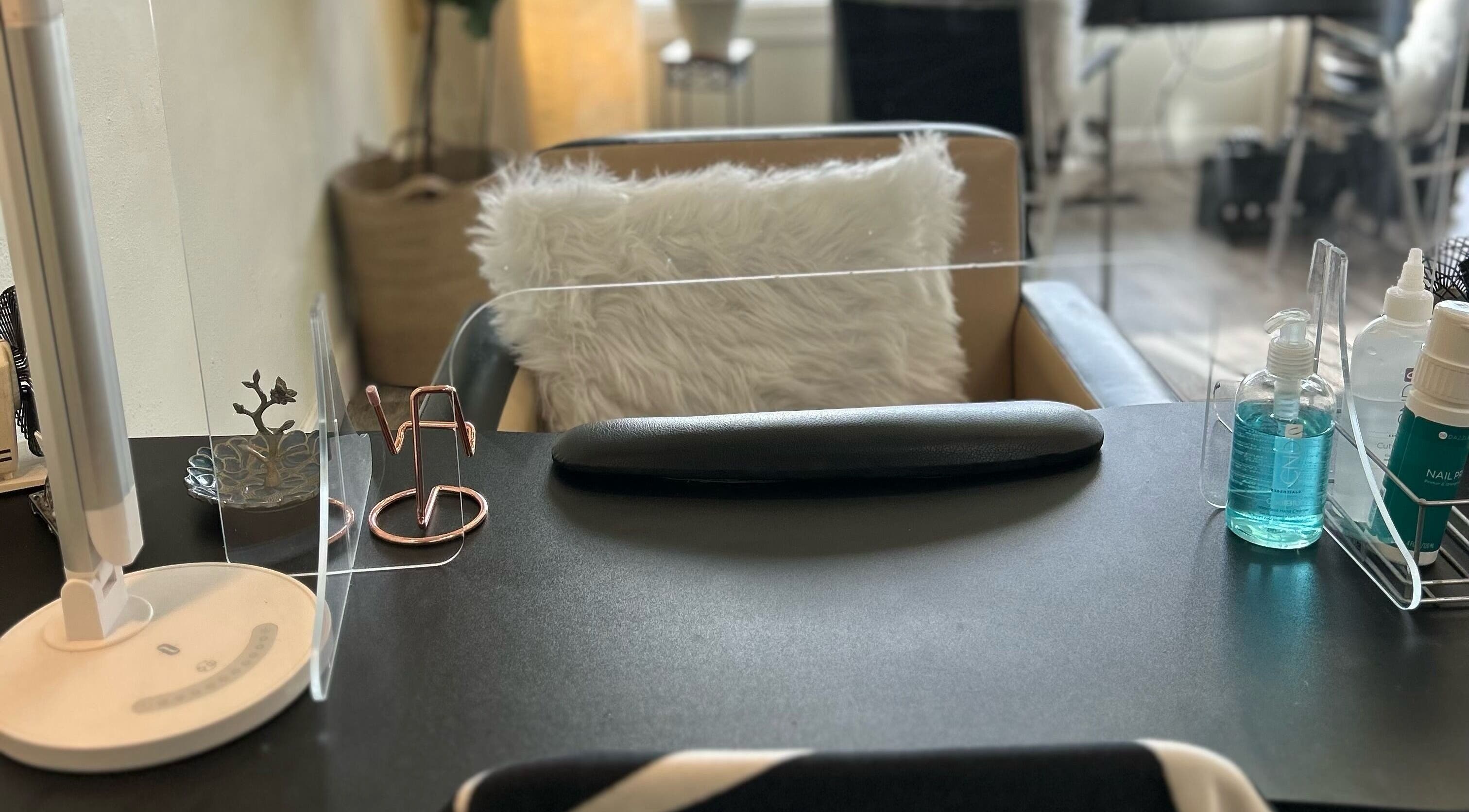 Modern nail station setup at Nails Essential Spa in Cohasset, Massachusetts, US, offering a relaxing experience.