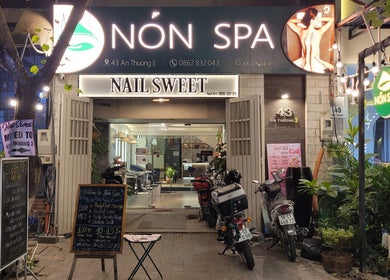 Entrance of Nón Spa in Đà Nẵng, Đà Nẵng, VN, showcasing exterior signage and decor.