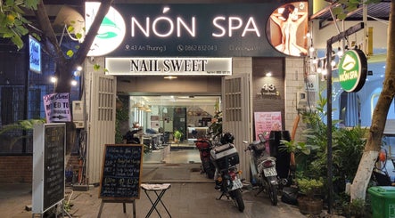 Entrance of Nón Spa in Đà Nẵng, Đà Nẵng, VN, showcasing exterior signage and decor.