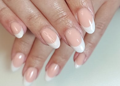 Perfectly manicured French nails at The Rainbow Studio, Southampton, GB, showcasing professional nail care.