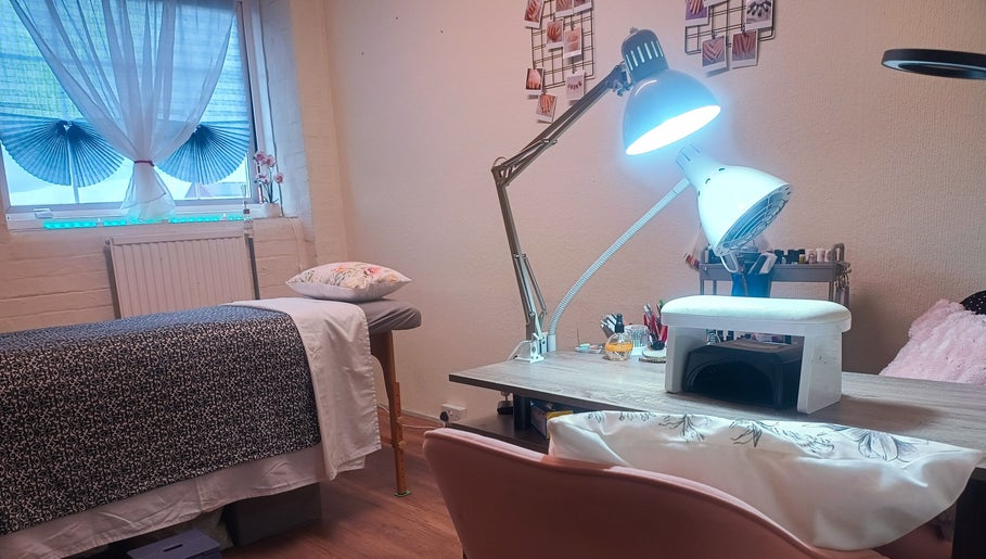Relaxing treatment room at The Rainbow Studio, Southampton, GB with a massage table and manicure station.