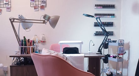 Nail treatment station at The Rainbow Studio, Southampton, GB, featuring tools and polish racks.