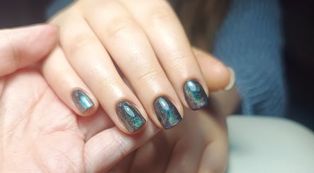 Shimmering nail art at The Rainbow Studio, Southampton, GB, showcasing elegant manicure design.