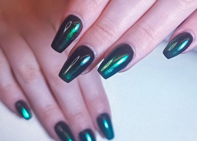 Emerald green nails design at The Rainbow Studio, Southampton, GB, showcasing glossy allure.