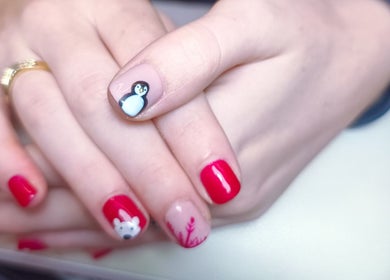 Creative nail art with penguin and bear designs at The Rainbow Studio, Southampton, GB.