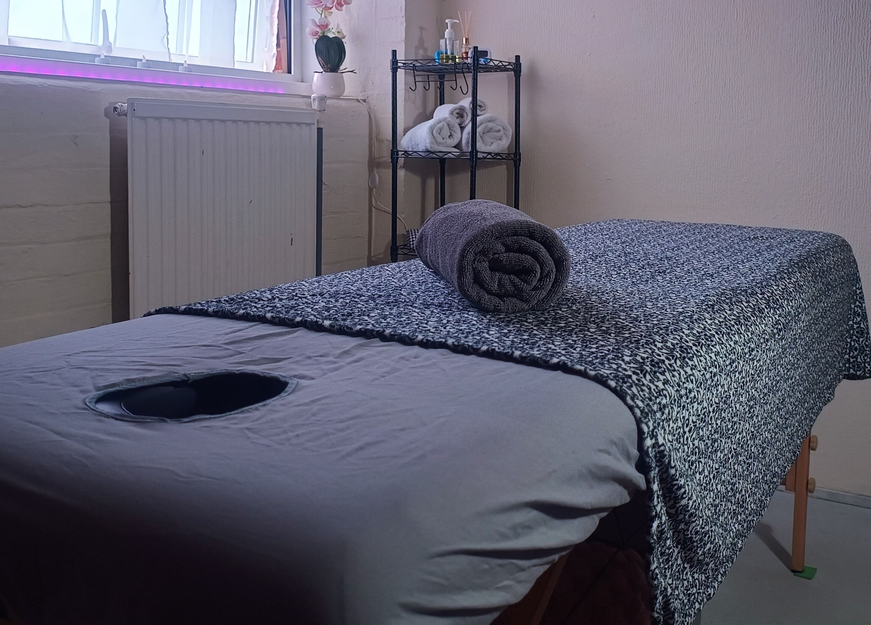 Relaxing massage table setup at The Rainbow Studio, Southampton, GB, ready for a calming wellness session.