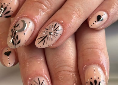 Elegant nail art at Danie Beauty in Hillsborough, England, GB, featuring intricate black and silver designs.